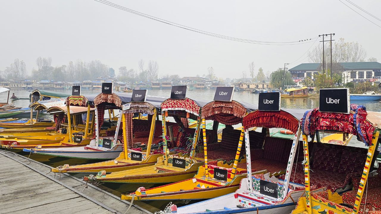 The shrouded lake, typically vibrant and picturesque with 'shikaras' (houseboats) became barely visible through the fog, adding to the quiet and creating an aura of calm and stillness. (In Pic:  Uber has launched its water transport service in India, with a booking of a shikara at Dal Lake in Srinagar through its app)