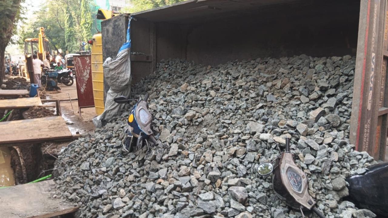 Truck overturns in Malad after road caves in, two scooters damaged