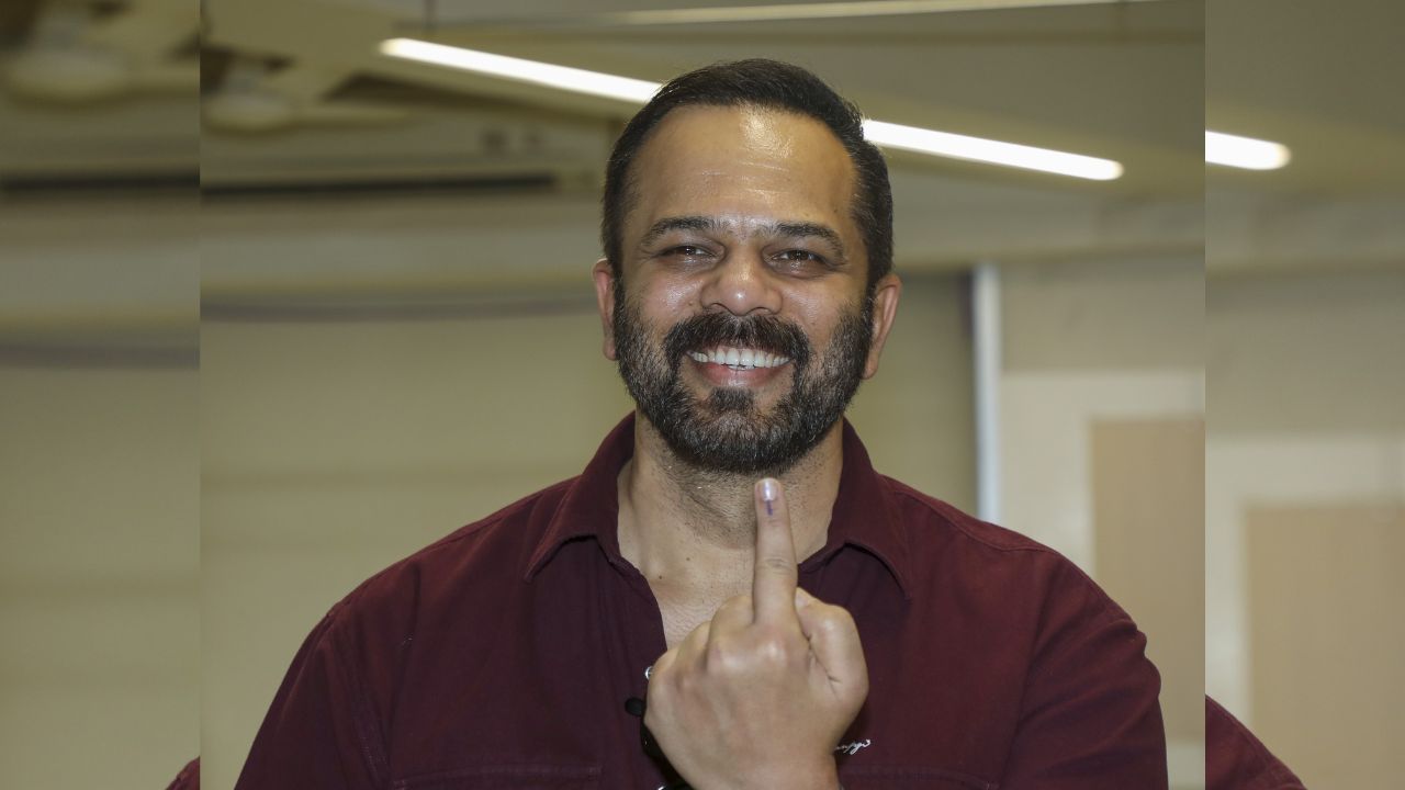 Bollywood filmmaker Rohit Shetty shows his finger marked with indelible ink after casting vote in Mumbai. (Pic courtesy: PTI)