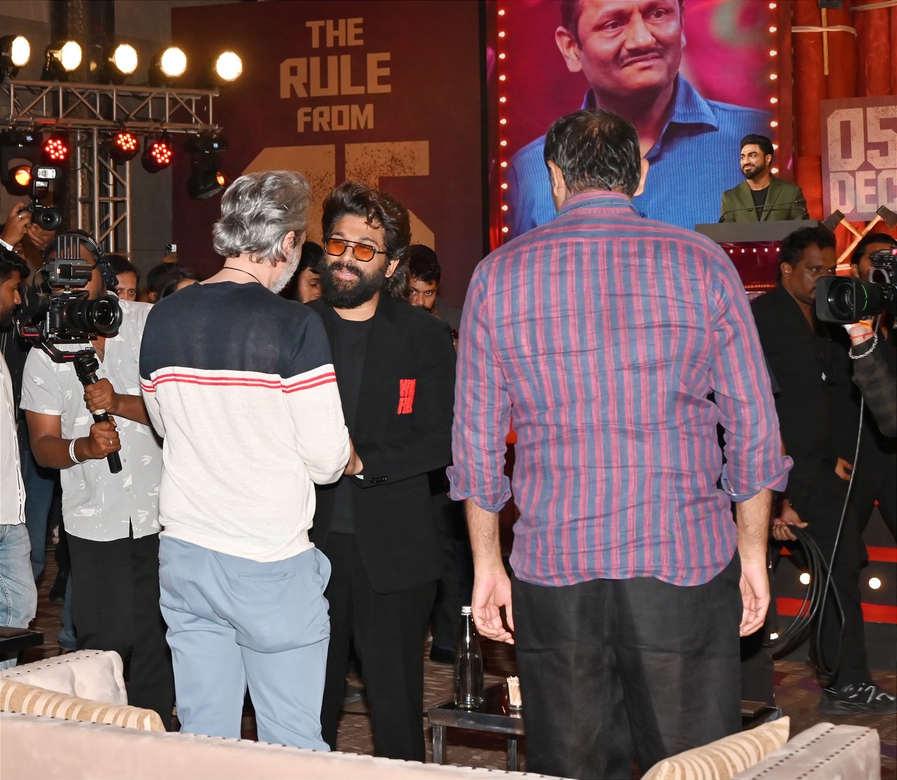 Allu Arjun greets distributor Anil Thadani at the grand Pushpa 2 press meet in the city