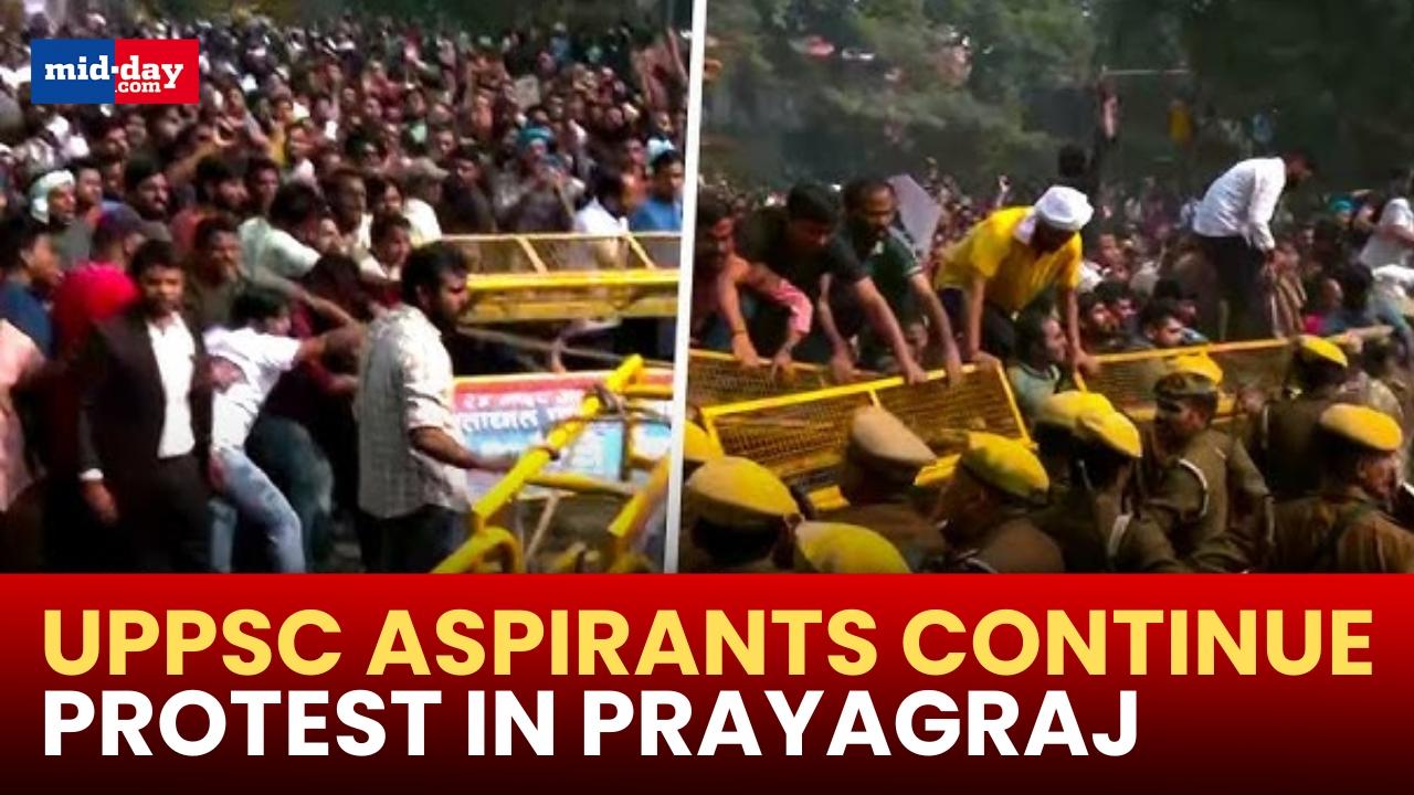  UPPSC Students continue to protest in Prayagraj, jump off police barricades