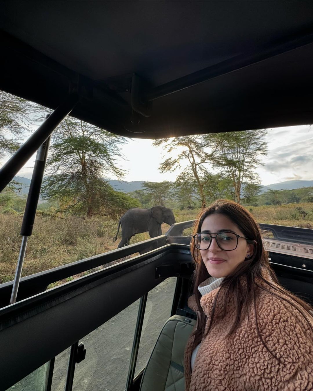 This picture features Panday taking a selfie as she spotted a cute baby elephant in the background while visiting the jungle