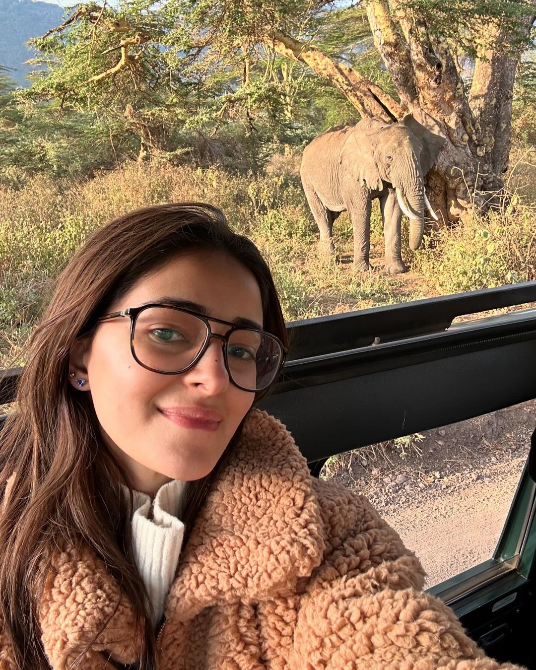 Another picture in the carousel has Ananya on an open jeep, clicking a selfie. The actress wore a white sweater paired with a brown jacket